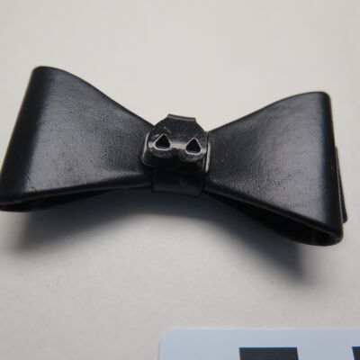 Close up of clip fastener.: Origsize: 0.5" (h) x 1" (w) x; Origformat: Artifact