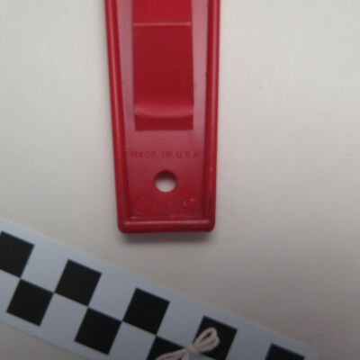 Close up of text on back of ice scraper.: Origsize: 3.75" (w) x 9.5" (l); Origformat: Artifact