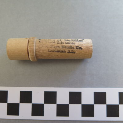 Continued text on side of case.: Origsize: 2.5" (h) x 0.75" (di; Origformat: Artifact