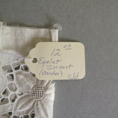 Tag on lace: Origsize: 4.5" (w) x 31.5" (l; Origformat: Artifact
