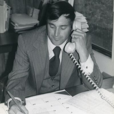 Man on Phone at Desk