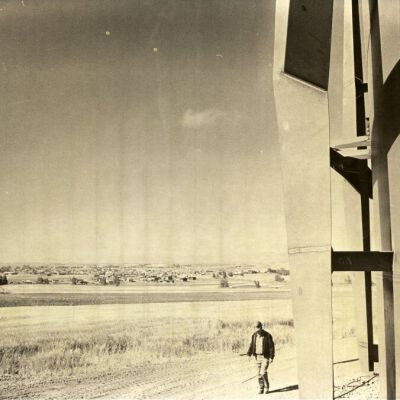 Worker walking near a Broomfield reservoir structure: Origsize: 8" x 10"; Origformat: Print-Photographic; Resolution: 500dpi