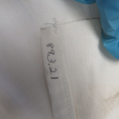Close up of number on apron.: Origsize: 1.25" (w) x 35" (l); Origformat: Artifact