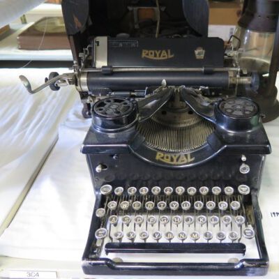 Front of typewriter: Origsize: 10" (h) x 16" (w) x; Origformat: Artifact