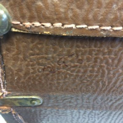 Number on the lett side of the bottom of the suitcase: Origsize: 14.5" (h) x 25" (w); Origformat: Artifact