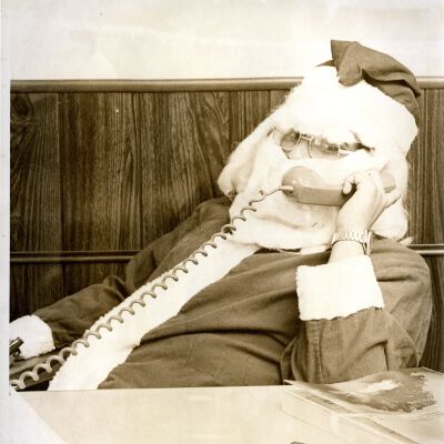Office worker dressed as Santa Claus - on the phone "A Call"