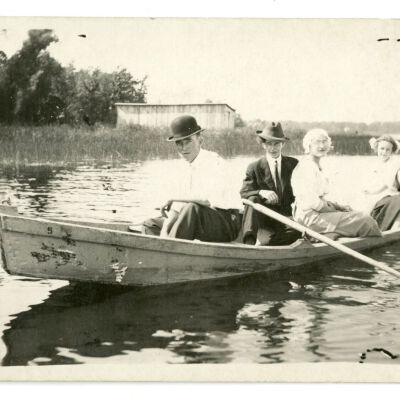 Ellenor Brown and others posing in a boat: Origsize: Unknown; Origformat: Postcard; Resolution: 300dpi