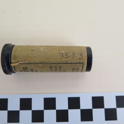 Side of package: Origsize: 2.5" (h) x 1" (dia); Origformat: Artifact