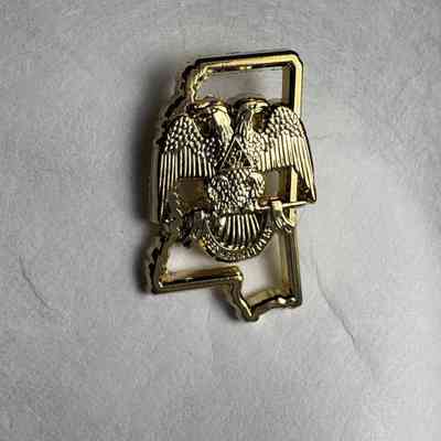 Pin: Gold. Scottish Rite Double Eagle over the outline of Mississippi. Belonged to PGM James O. Wood. (c. 2000)