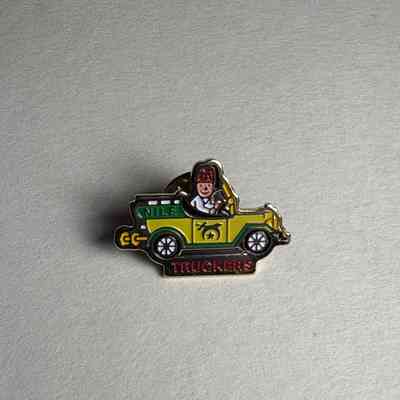Pin: Shriner riding in a yellow car with shrine symbols. Belonged to PGM James O. Wood (c. 1999).
