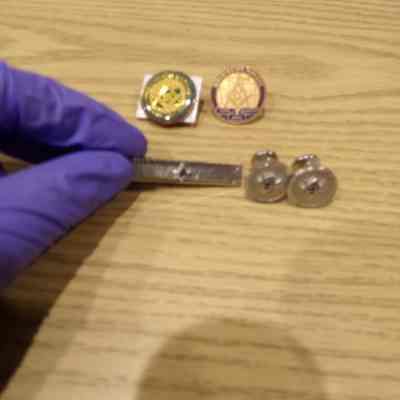 picture of tie clip and cufflinks that CC voted to deaccession on 7/17/23.