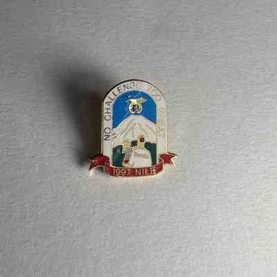 Pin: Shriner carrying child away, mountain in distance. Seattle Nile Shriner (1997)