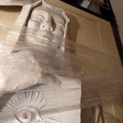 Statue: Mason holding tablet with Masonic Eye Symbol