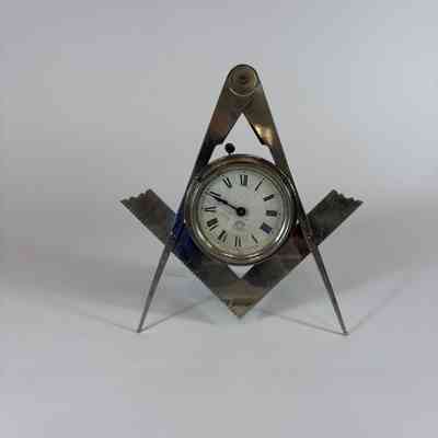 Clock: Silver Square and Compass clock. New Haven Clock Company. early 20th century.