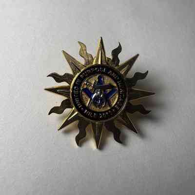 Pin: Shriner. Sun with rays. "Nile 2010" Donated by PGM James O. Wood. (2010)