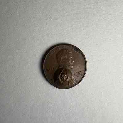 Coin: US Penny with Square and Compass stamped on the face. (1969). Belonged to PGM James. O. Wood