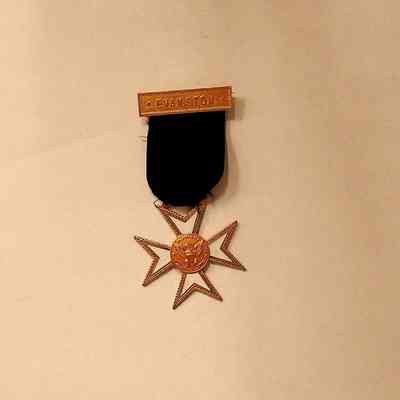 Medallion: Gold and white with black ribbon. "Evanston". Knights Templar