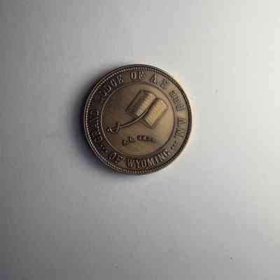 Coin: Copper. Grand Lodge of Wyoming Centennial. Belonged to PGM James O.Wood (1974)