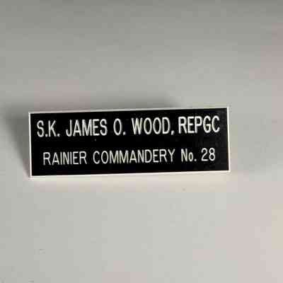 Name tag: "S.K. James O. Wood, REPGC, Rainier Commandery No. 28" Belonged to PGM James O. Wood.