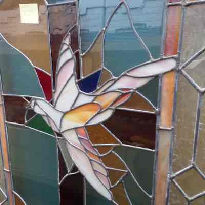 Stained Glass Window: shows bird and flowers. From the Fourth Floor Chapel of the Masonic Retirement Home in Zenith, WA