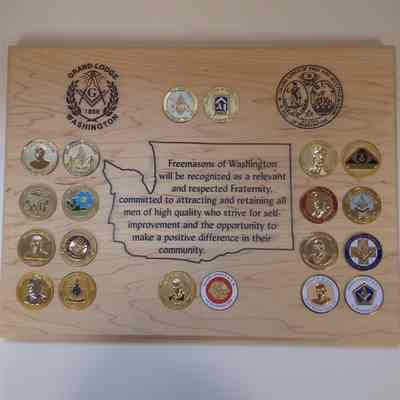 Plaque: GM coins embedded around Washington state outline, contains both seals of GLWA