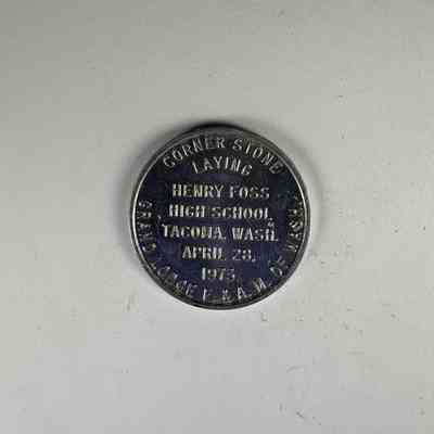 Token: Cornerstone laying of Henry Foss High School. Belonged to PGM James O.Wood. (1973)