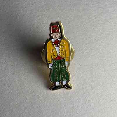 Pin: Shriner wearing a fez. "Al Kader Arab Patrol" Donated by PGM James O. Wood (c.1999)