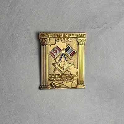 Pin: "Grand Lodge of Manitoba: MWB Stano Spina Grand Master (2014-2015)" Presumably collected by PGM Sam Roberts during his year as Grand Master.