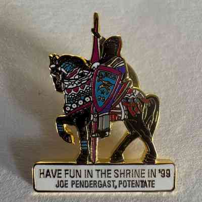 Pin: Shriner. Knight riding black horse facing right. "Joe Pendergast, Potentate" Donated by PGM James O. Wood. (1999)