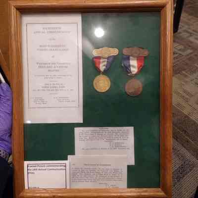 Former display of medals. Removed from frame on 9/21/23