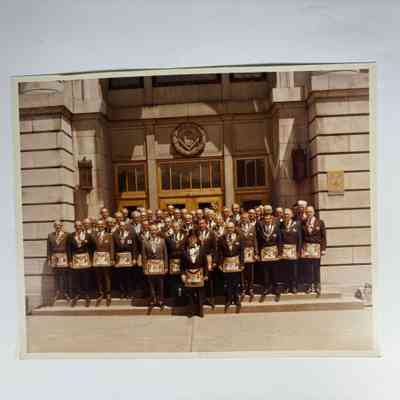 Photograph: Grand Lodge Officers outside Grand Lodge Offices. Signed by PGM Thomas H. Craig (1973-1974)