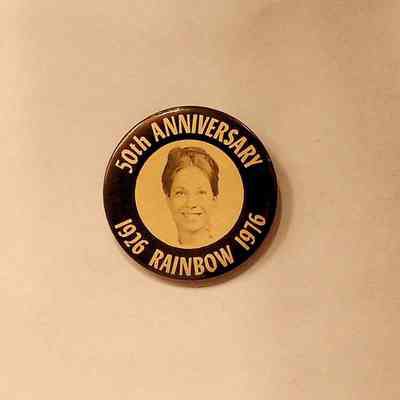 Button: Black and white with profile of woman. "50th Anniversary Rainbow" (1976)