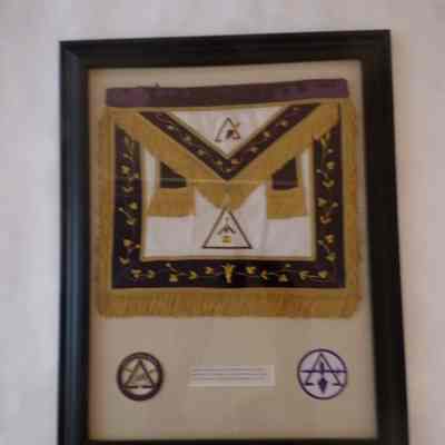 Framed Apron: "Royal and Select Masters "Past Illustrious Masters" apron presented to J. W. Norton by John D. Kelliher (1977)