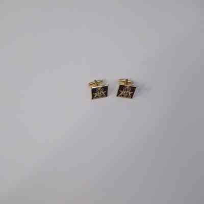 Cufflinks: Jim Mendoza, Grand Master (2016). Has square and compass on them as well as a purple ribbon. "Be the difference"