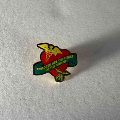 Pin: Shriner. "Aladdin/Children are the Heart of the Shrine/ 1999." Donated by PGM James O. Wood (1999)