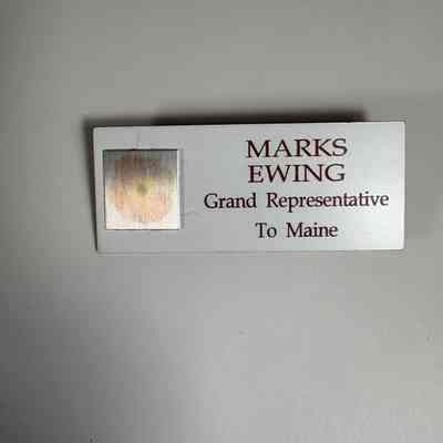 Name Tag: "Marks Ewing/Grand Representative to Maine" Late 20th Century. Clip on the back.