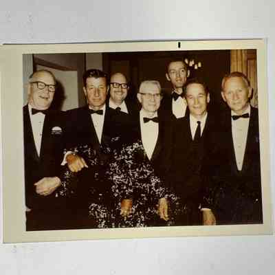 Photograph: Seven Masons wearing Tuxedos, likely at Grand Lodge Annual Communication (c. 1970s-1980s)