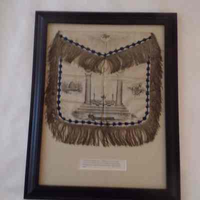 Framed Apron: "Early American Masonic Apron. belonged to H.B. Brattain, made a mason October 1853"