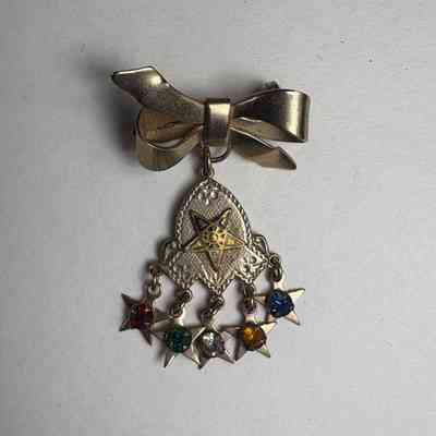 Brooch: Eastern Star. Silver with a bow and gem tassels. Belonged to Marion Feaster. c.20th Century.