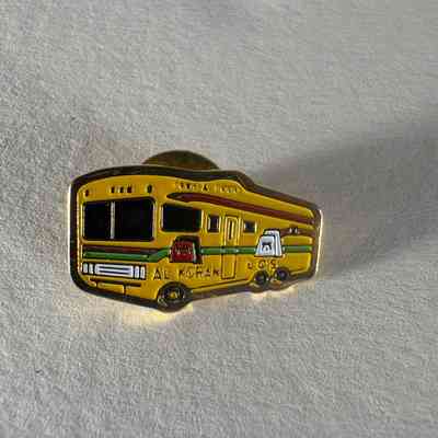 Pin: Yellow bus facing left. "1995 & 1999/ Al Koran/Los" Donated by PGM James O. Wood. (1999)