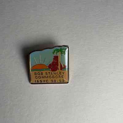 Pin: Lobster on beach wearing Fez. "Bob Stanley Commodore/ IASYC 98-99" Donated by PGM James O. Wood (1999)