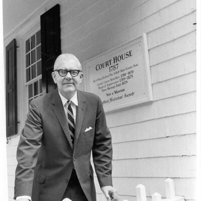 Mr. Halstead Park on the porch of the Bedford Court House