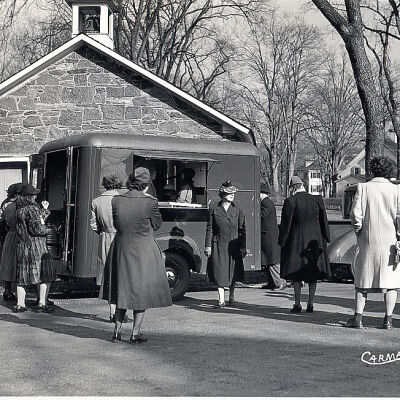 American Red Cross Mobile Canteen with crowd outside of the School House