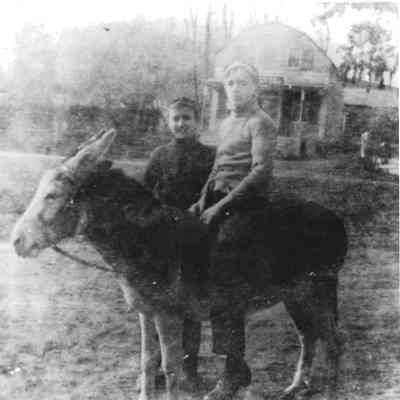 Two kids in front of Bedford Store