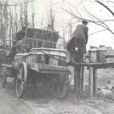 Carriage picking up milk bottles
