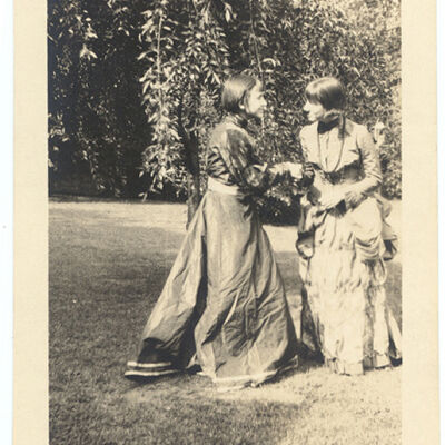 photo of two girls outdoors in formal dress