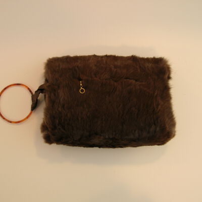 Young girl's brown fur muff