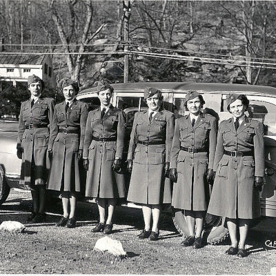 American Red Cross workers outside of the School House