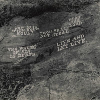 Rock with religious graffiti