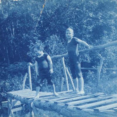 Two boys on bridge